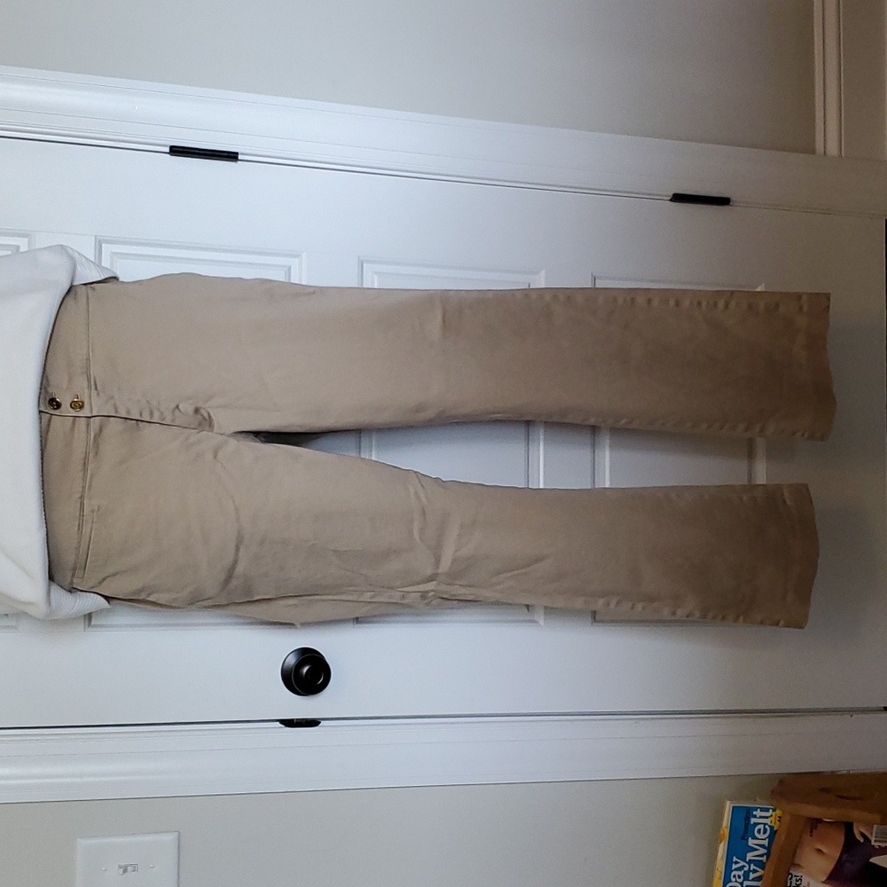 Beige boot cut dress pant with double gold button at waist